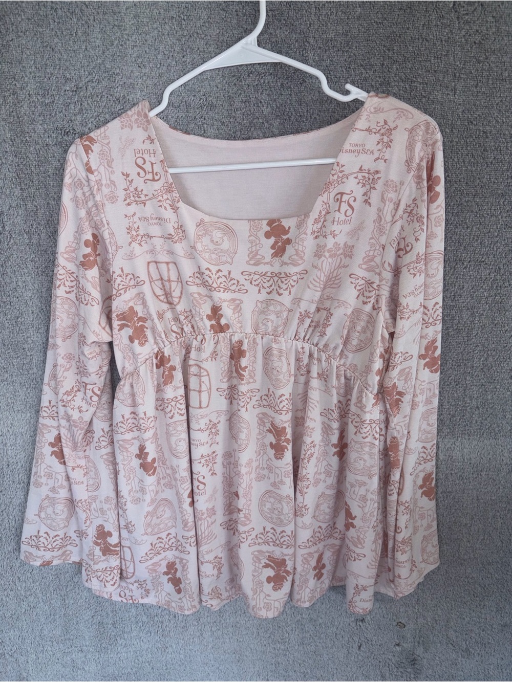 Disney Women’s size large Long Sleeve Printed Peplum Top - Pink Tokyo Disney sea